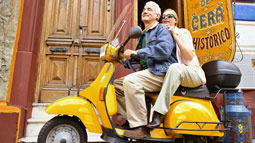 Seniors riding a scooter