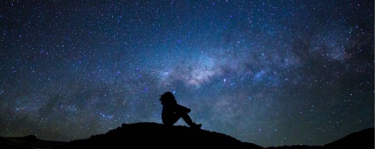 Allianz - silhouette of man looking up at stars