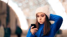 stressful woman looking at her cellular phone