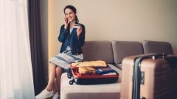 woman on phone with credit card