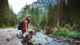 woman hiking alone in forest