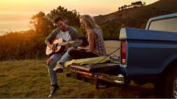 couple on road trip with guitar